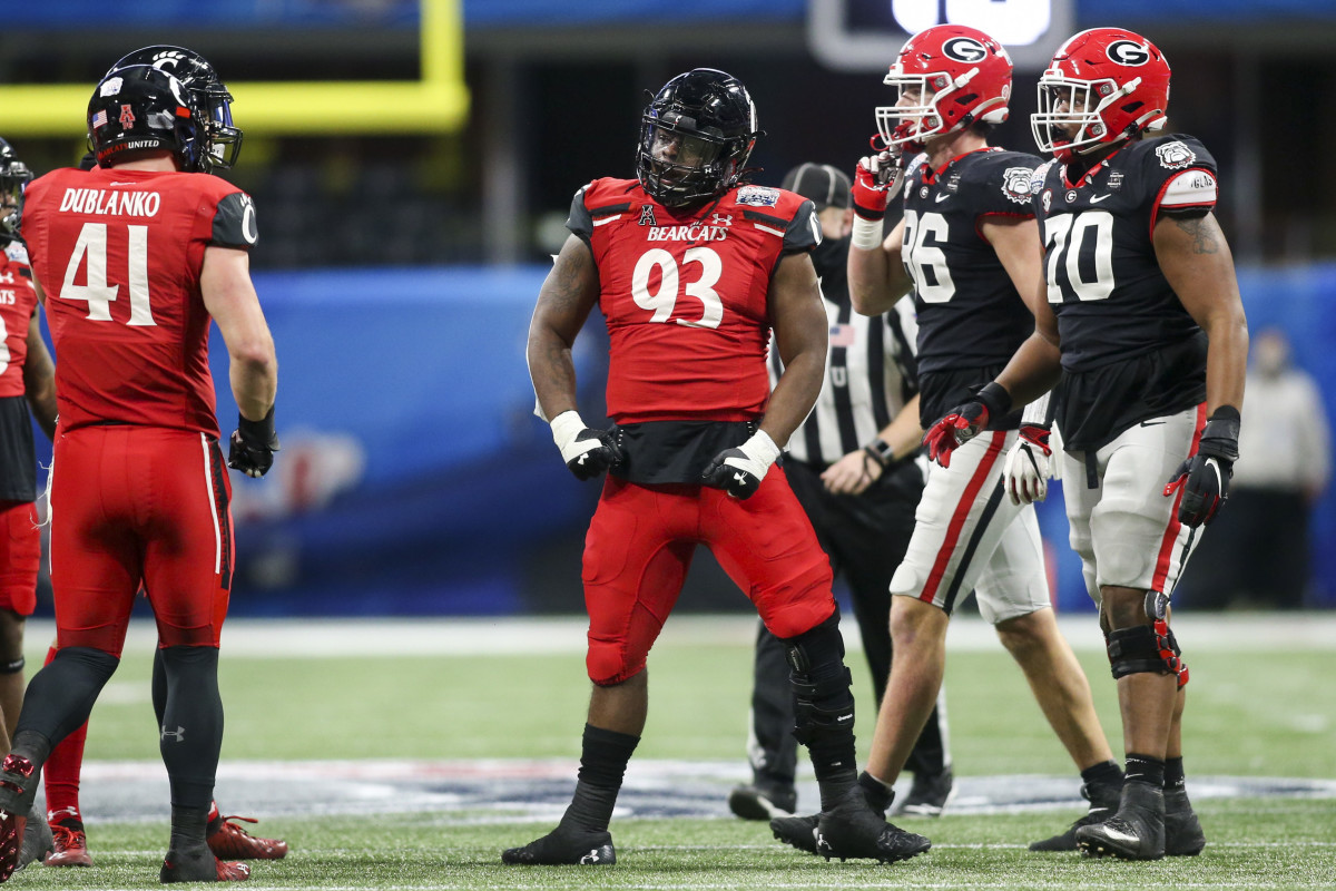 Jan 1, 2021; Atlanta, GA, USA; Cincinnati Bearcats defensive tackle Elijah Ponder (93) reacts after a tackle against the Georgia Bulldogs in the first quarter of the Chick-fil-A Peach Bowl at Mercedes-Benz Stadium. Mandatory Credit: Brett Davis-USA TODAY Sports